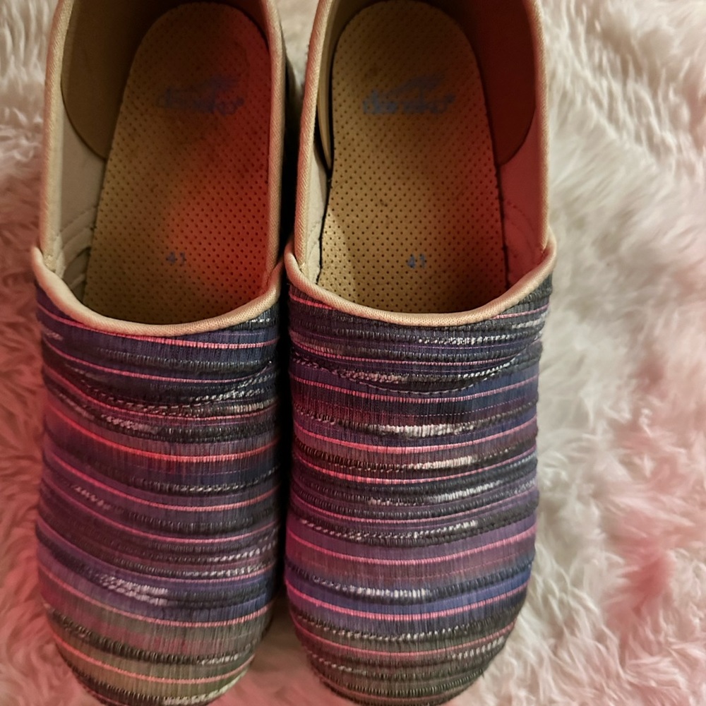 Women nursing Dansko Clog shoes